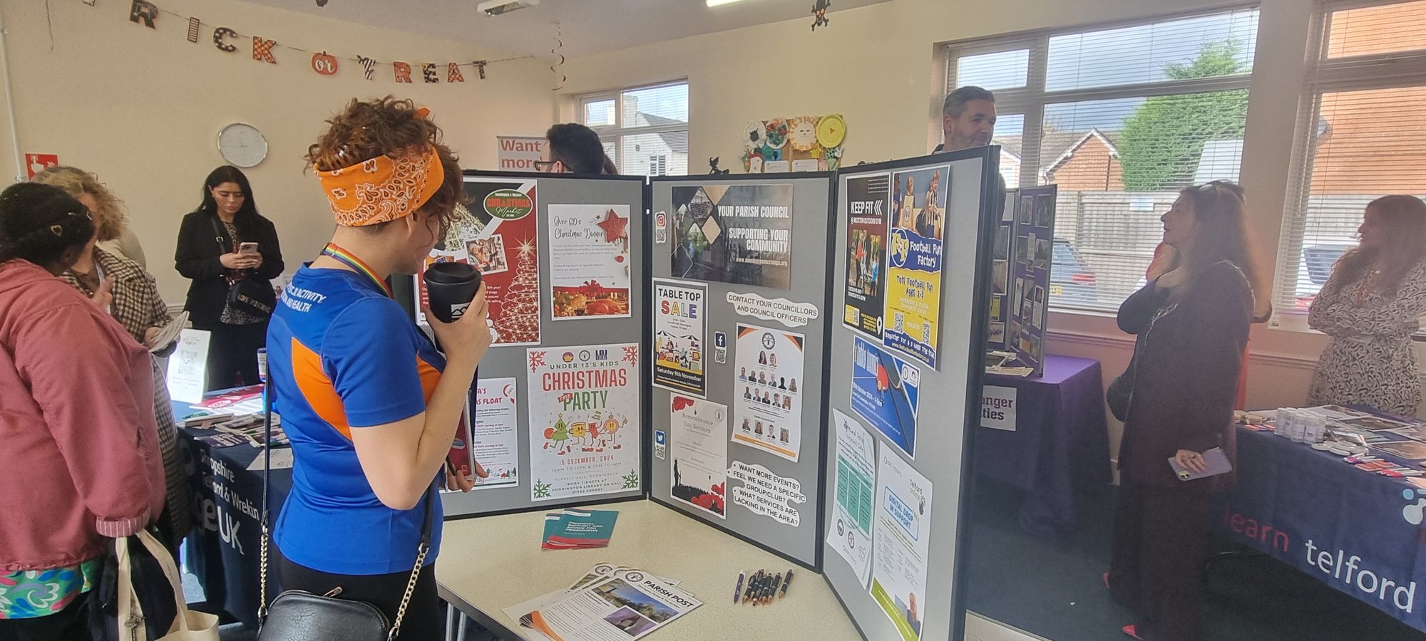 An image of a woman looking at one of the stalls at the Donnington Community Open Day.