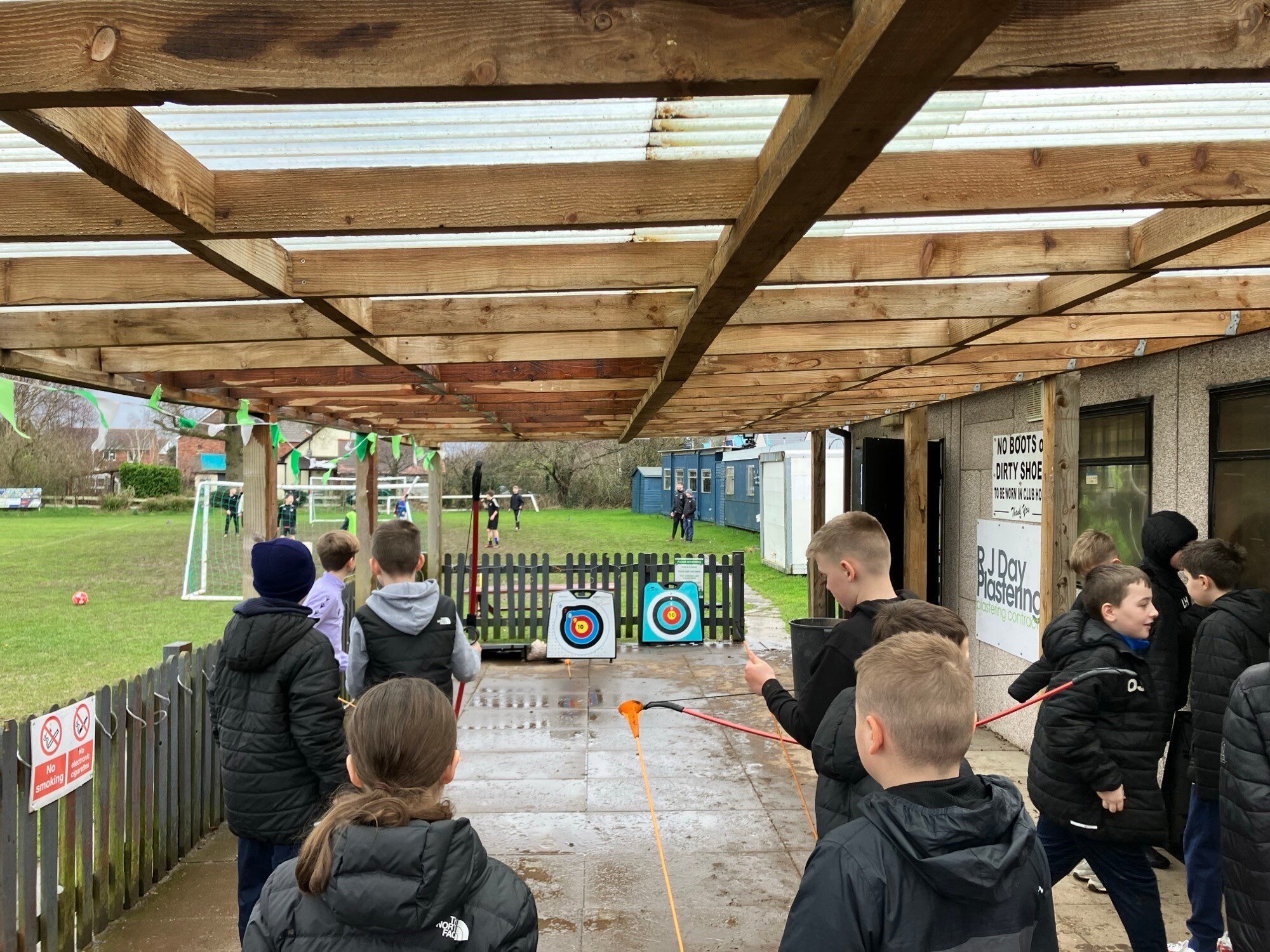 Children trying archery