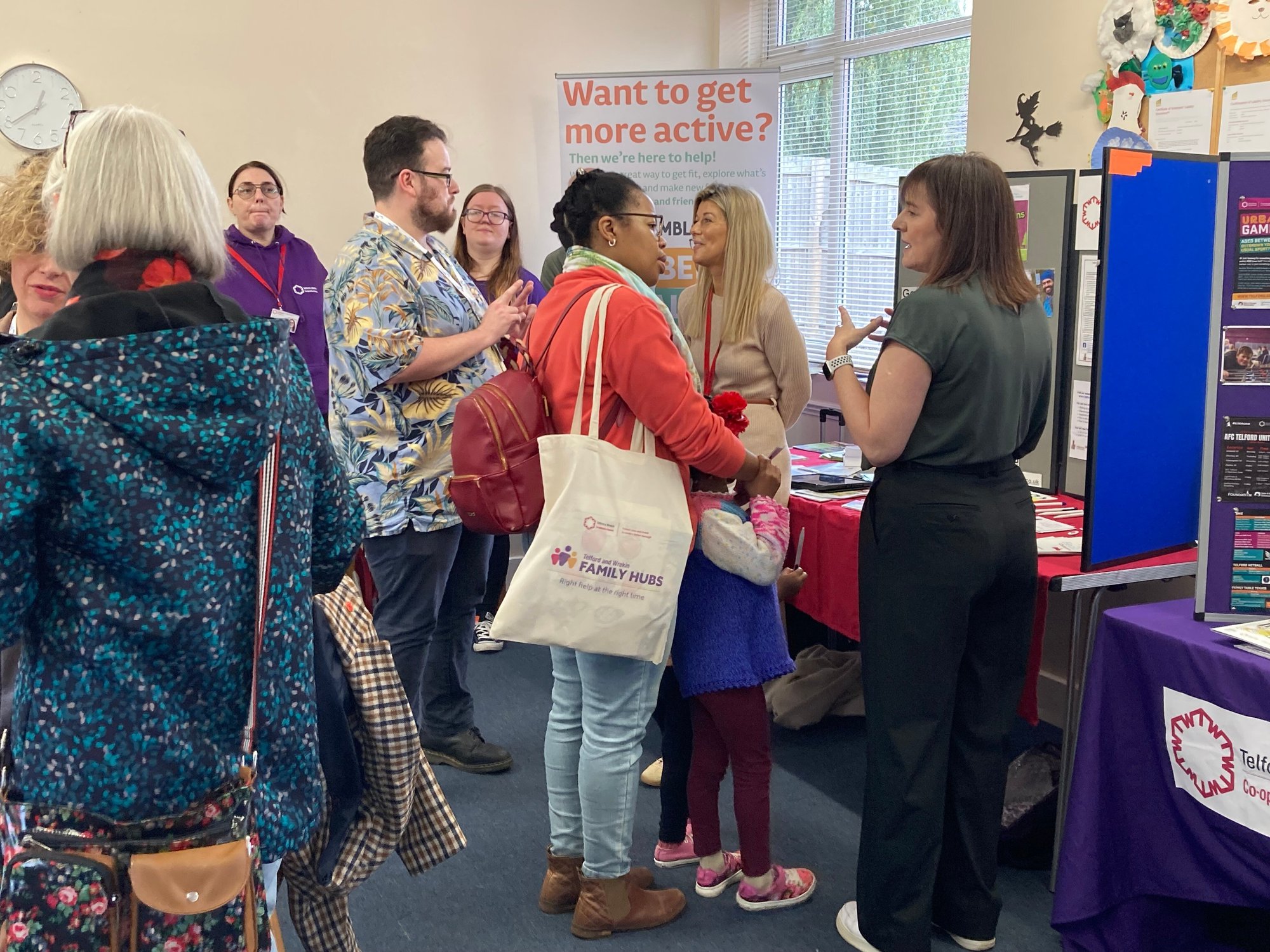 An image of Donnington Residents getting information from local organisations at an Open Day event. 