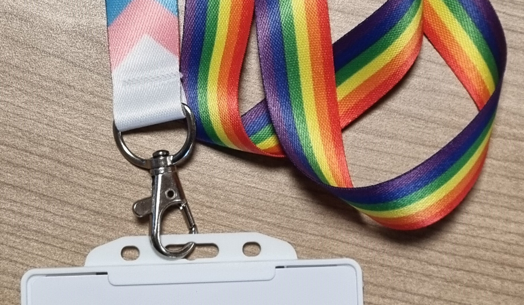 A photo of a bright coloured rainbow striped lanyard