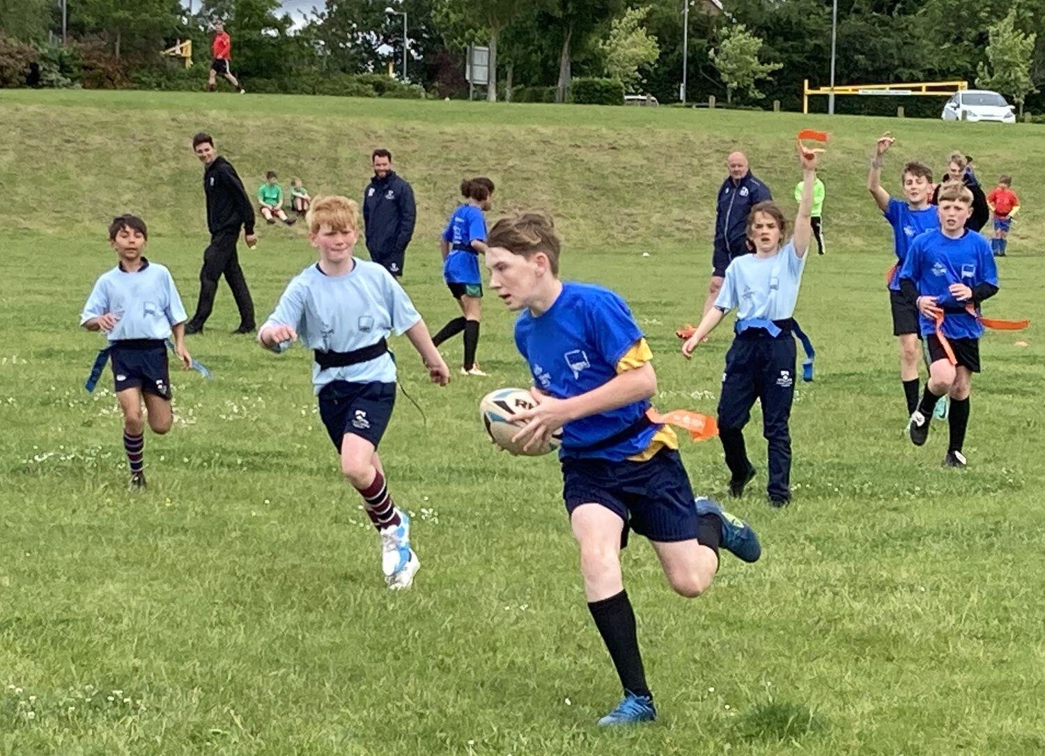 Boys playing rugby at Primary School Games event