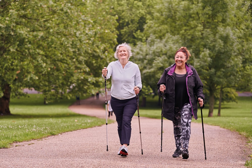 Sport England females walking outdoors in green space