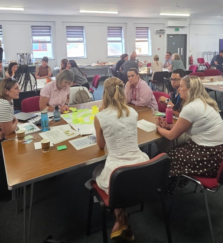 A table discussion at our July system leadership day.